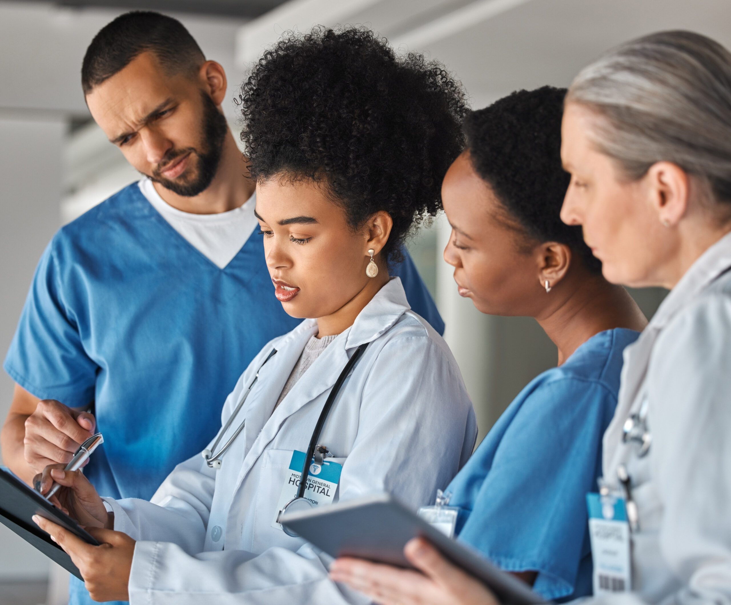 Doctor schedule, meeting and medical worker talking to hospital team about healthcare agenda. Group of medicine employees in communication about collaboration and teamwork on paper in clinic Medical Professionals Walking Down Stairs